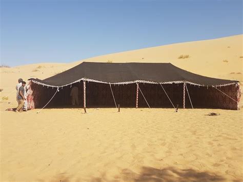 Rigging A Traditional Bedouin Tent In The Abu Dhabi Dessert