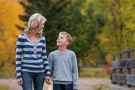 Mother And Son Walking And Talking In A Park In Autumn Edmonton