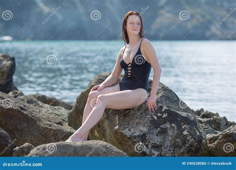 Pretty Girl Resting On Wild Rocky Seashore Stock Photo Image Of Bent