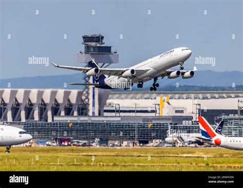 Taking Off Airbus A340 300 Of The Airline Lufthansa Tower And Terminal