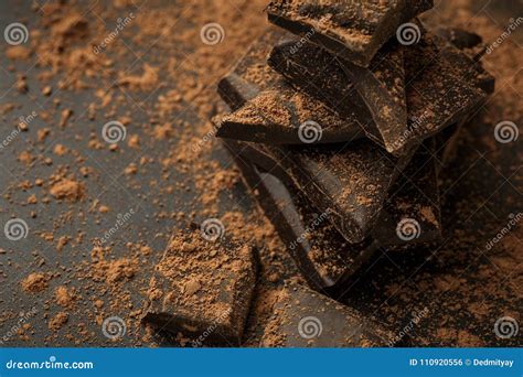 Pieces of Dark Chocolate in Cocoa Powder Stock Photo - Image of ...