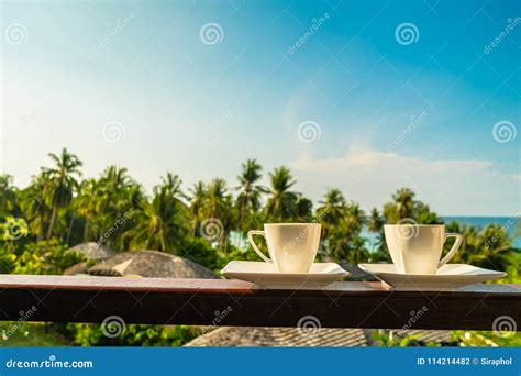 White Coffee Cup With Beautiful Paradise Island Sea And Beach Stock