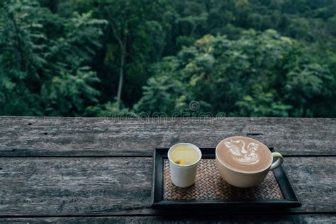 A Cup Of Hot Latte Coffee Mug And Hot Tea Placed On A Wooden Floor Stock Photo Image Of Nature