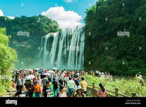 Tourists Visit The Huangguoshu Waterfall Scenic Spot During The