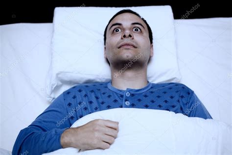 Insomniac Man Trying To Sleep Stock Photo By ©minervastock 63268973