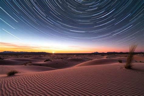 Premium AI Image | Timelapse of star trails above desert sand dunes ...