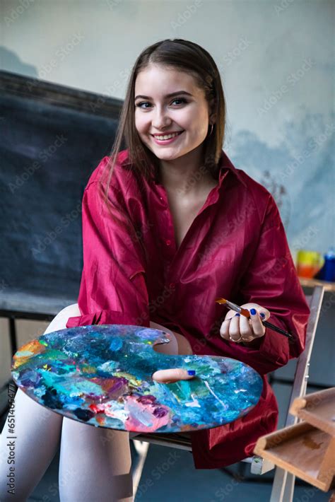 Pretty Teen Girl Painter In Red Shirt Painting At College Art Lab Class Smiling Looking At