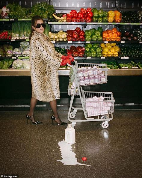 Kourtney Kardashian Models Faux Fur Coat And Red Gloves During Messy