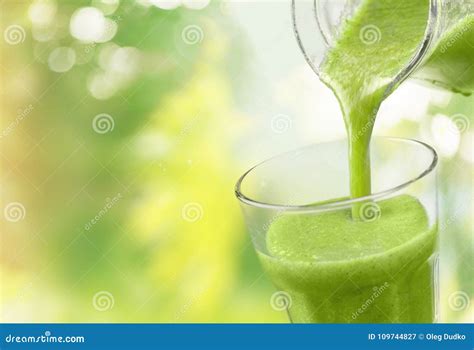 Green Vegetable Smoothie Pouring In Glass Stock Image Image Of