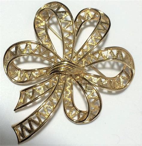 Monet Textured Bow Brooch Pin Gold Tone Setting Signed Classic With