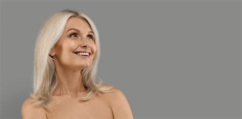 Premium Photo Dreamy Beautiful Nude Mature Woman Looking Up At Copy Space