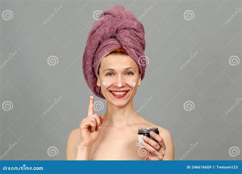 Portrait Of A Cheerful Attractive Half Naked Woman With A Towel Wrapped