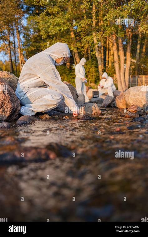 Female Scientist Collecting Water Sample From Sea Stock Photo Alamy