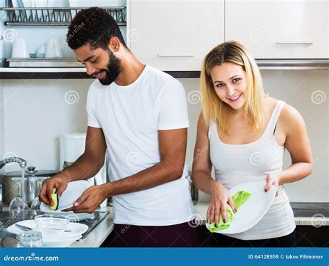 Interracial Couple Cleaning In The Kitchen Stock Image Image Of