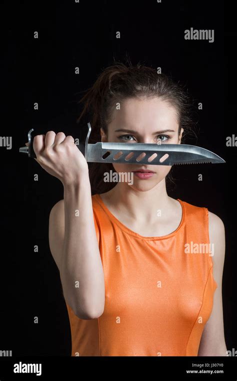 Young Woman Holding A Big Knife Stock Photo Alamy