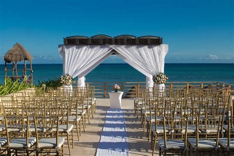 An Outdoor Wedding Set Up On The Beach