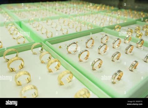 Gold Jewelry Engagement Rings Show In Retail Store Window Display
