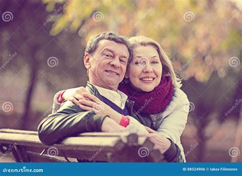 Mature Loving Couple In Spring Park Stock Photo Image Of Care Cuddling