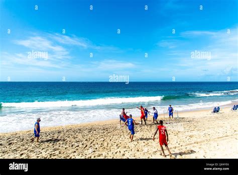 Men Playing Beach Soccer At Farol Da Barra Beach Front In Salvador City