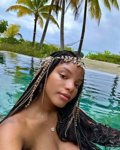 Halle Bailey Hides Her Belly With Big Blue Suit In New Video With Oprah As Pregnancy Rumors