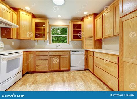 Kitchen Interior With Hardwood Floor And Wood Cabinets Stock Image