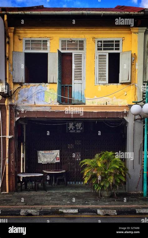 The Colourful Façade Of A Terraced Shophouse In The Old Main Bazaar At