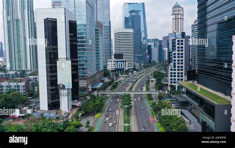 Drone view of quiet traffic on Sudirman road with skyscrapers in ...