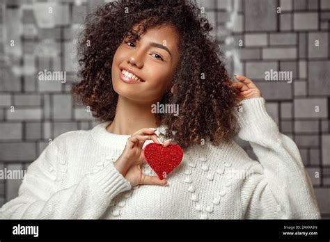 Close Up Portrait Of A Young Curly Haired African American Girl In A