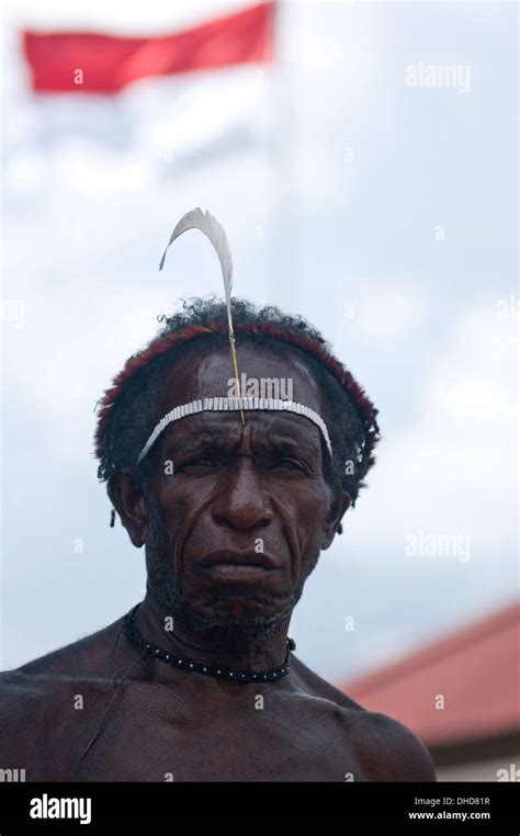 An Indigenous People Of Papua With Red And White Indonesian Flag Stock