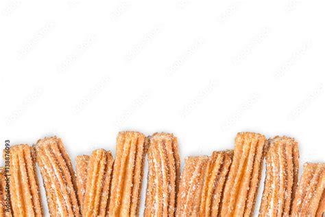 Churros Arranged In Row Isolated On White Background Stock Photo