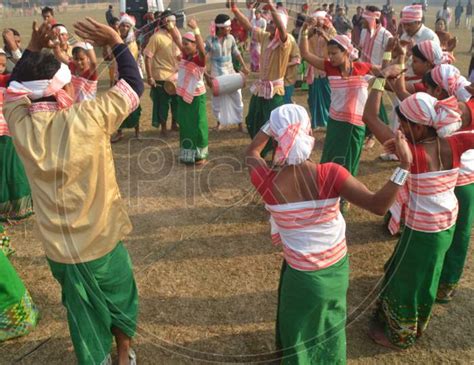 Image Of Assamese Tribal Woman Performing Bihu Dance In Magh Bihu