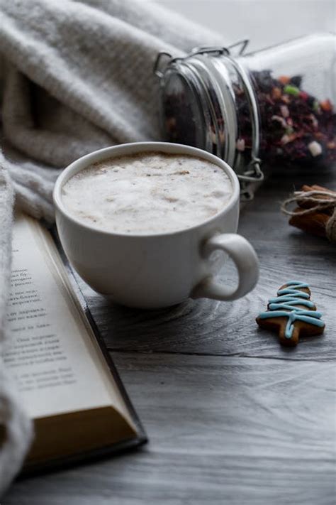 Cup Of Coffee Beside Open Book · Free Stock Photo