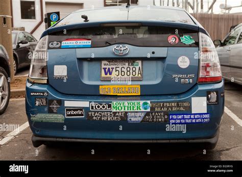 Toyota Prius hybrid car with many bumper stickers - USA Stock Photo - Alamy