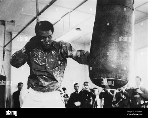 Muhammad Ali Cassius Clay American Boxer Training At Punch Bag Stock