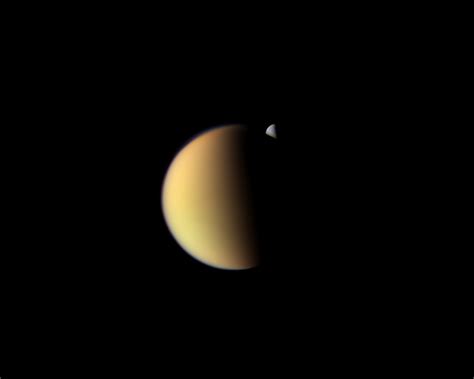 Rhea behind Titan | The Planetary Society