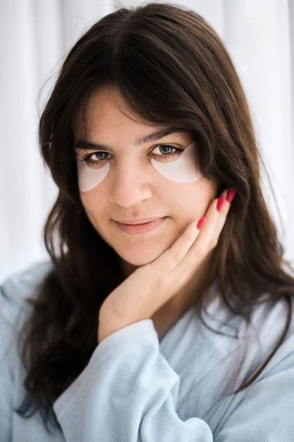 Free Photo A Young Caucasian Woman With Patches Under Her Eyes