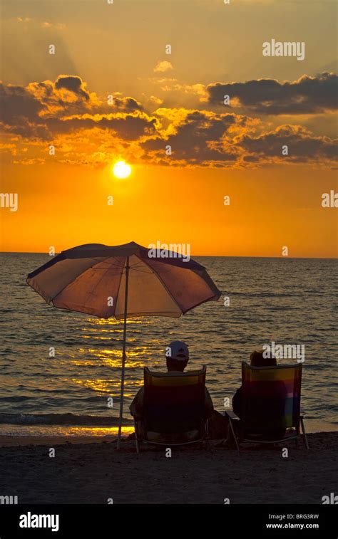 Couple Relaxing At The Beach Sunset Florida West Coast 2008 Stock Photo