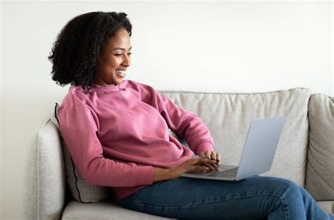 Premium Photo Happy Millennial African American Curly Woman Typing On