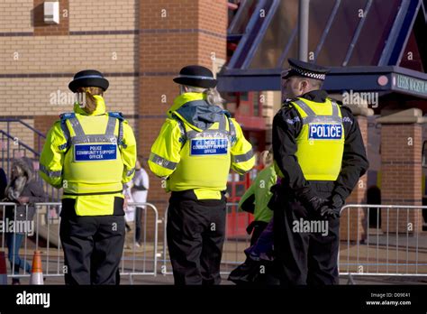 West Yorkshire Police Officer Standing With 2 Police Support Officers