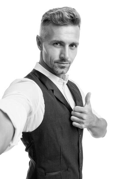 Premium Photo Serious Guy In Suit Vest Taking Selfie Giving Thumb