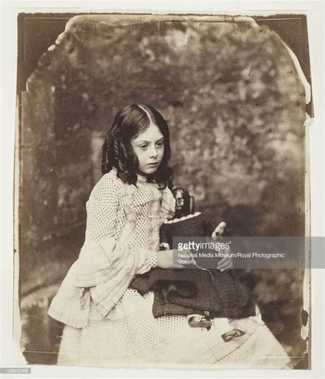 Lorina Liddell holding a doll, seated, Summer 1858. By, Dodgson,...