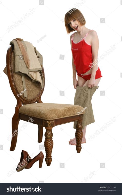 Beautiful Thirty Something Woman Dressing Or Undressing From Suit To Lingerie Over White