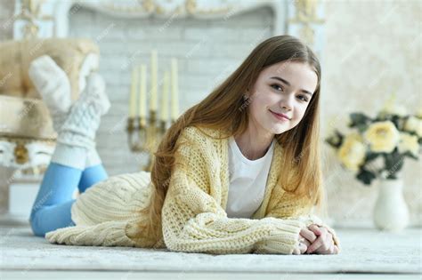 Premium Photo Portrait Of Beautiful Teen Girl Lying On Floor In Room