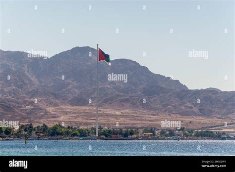 Aqaba Jordan November 6 2017 Flag Of Jordan Waving Over The City