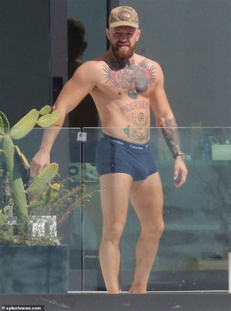 Shirtless Conor McGregor Displays His Muscular Tattooed Physique In