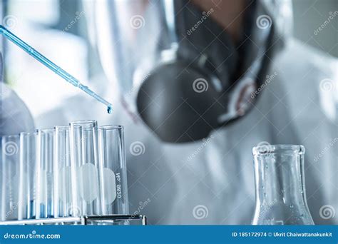 Close Up Of Dropping Liquid In To Flask Chemical Liquid Dropping Stock