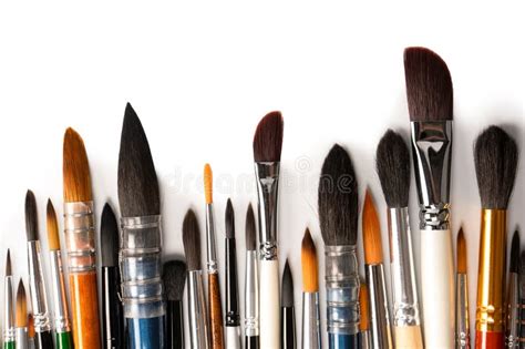 Mix Of Paint Brushes In A Row Isolated On A White Background Top View