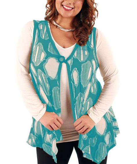 Daintily dressed in airy fabric with stripes of decorative lace, this ladylike vest is a nod to ...