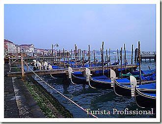 Several Blue Boats Are Docked In The Water