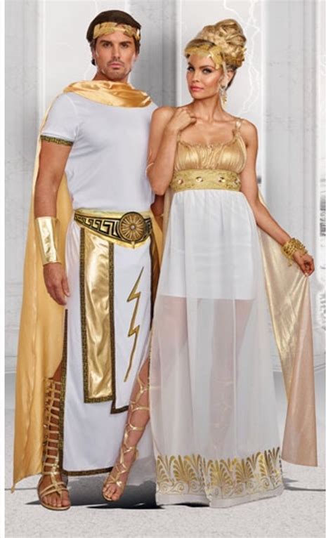 two people dressed in costumes standing next to each other on a white ...